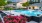a swimming pool in a courtyard with lounge chairs